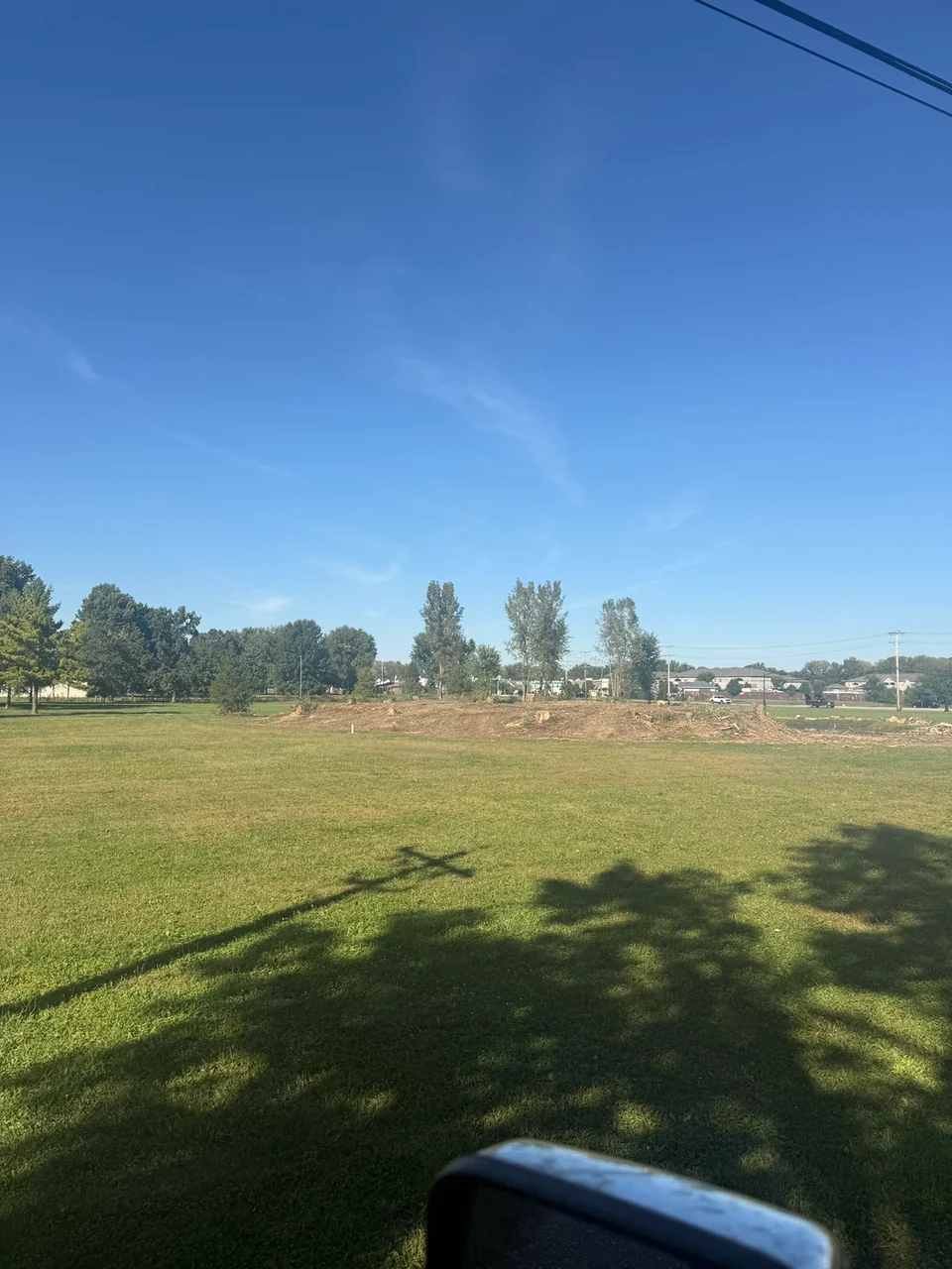 Cleared pond perimeter after land clearing project in Brownsburg Indiana